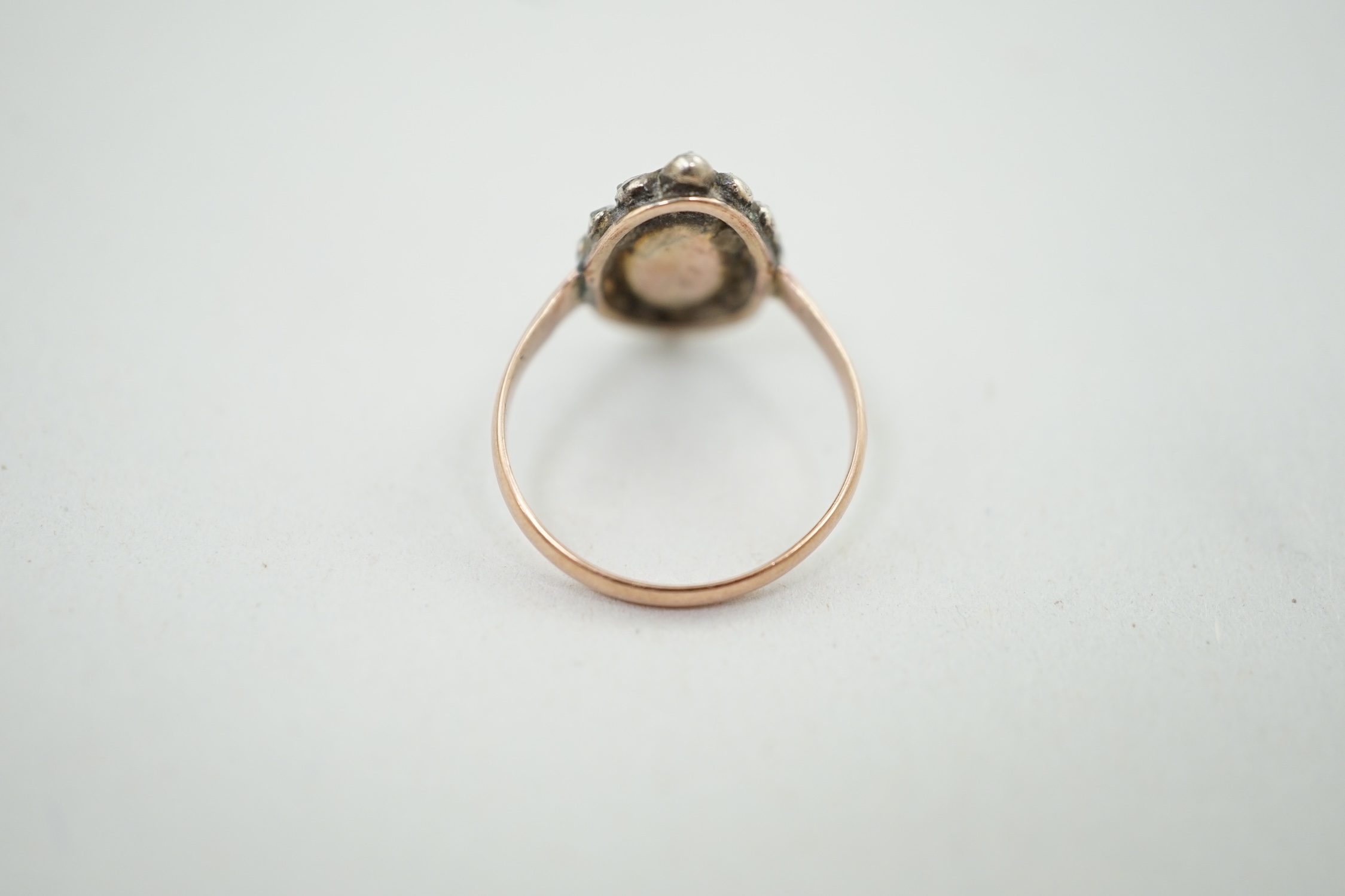 A Georgian yellow metal, enamel? and rose cut diamond cluster set navette shaped ring, size N, gross weight 2.9 grams. Condition - poor